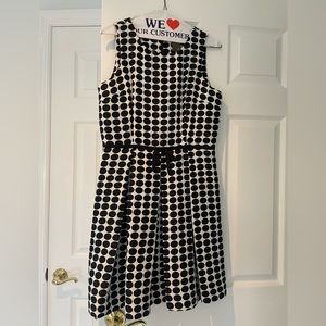 Dark navy blue and white polka dot sleeveless dress.  Size 6. Taylor